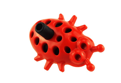 Ladybug dripper close-up, red body with black spout and round perforation pattern