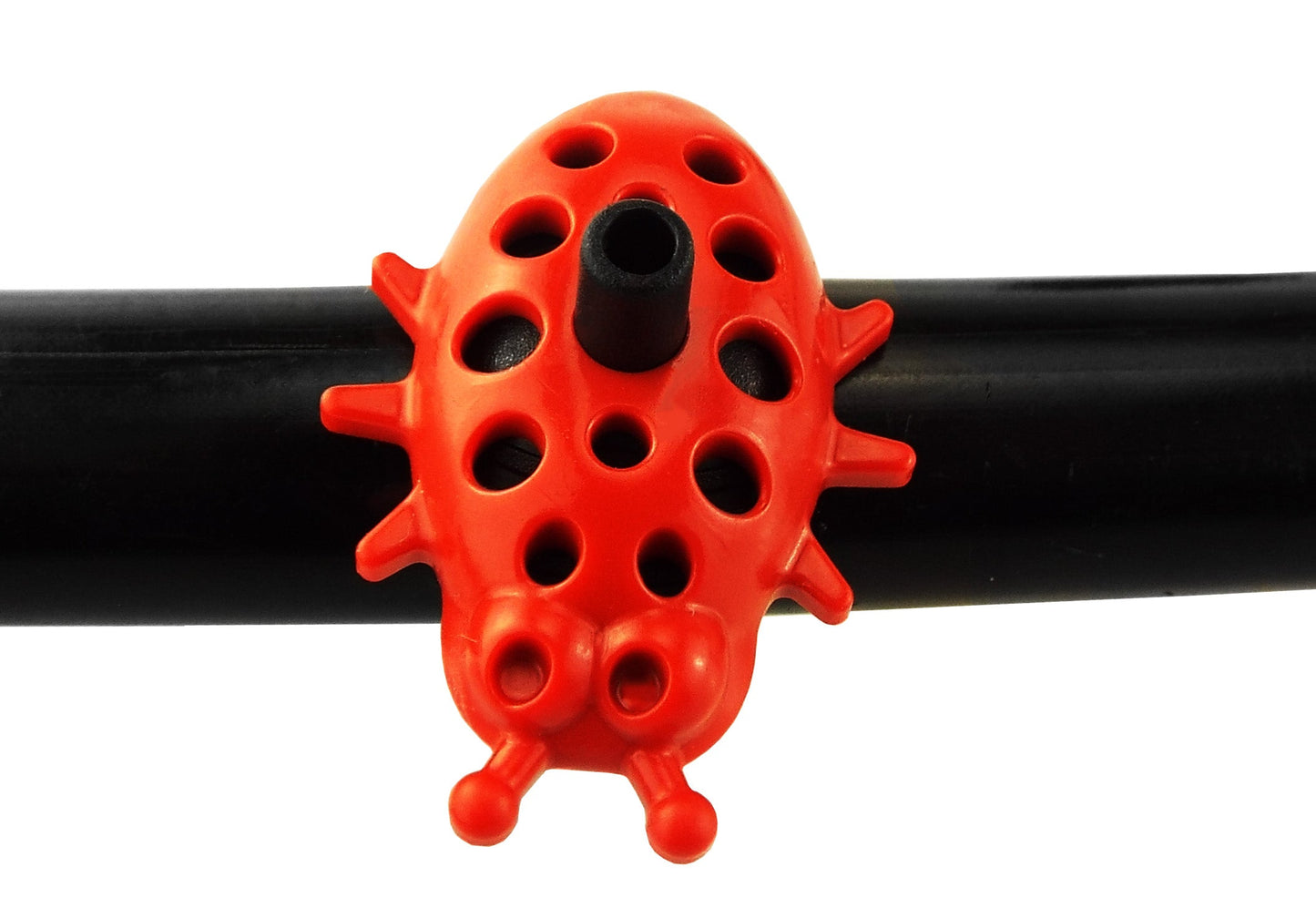 Ladybug dripper on black tubing, red insect form with perforations and outlet center