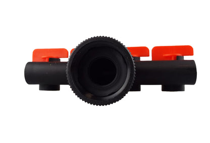 Micro drip manifold inlet view: black connector with ribbed dial and red valve handle