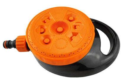 Static lawn sprinkler with orange top dial, black housing, and front hose connection