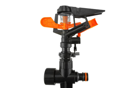 Pulsating sprinkler head on spike with orange spring core, black housing