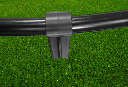 Black clamp and stake base holding a 16mm irrigation pipe securely