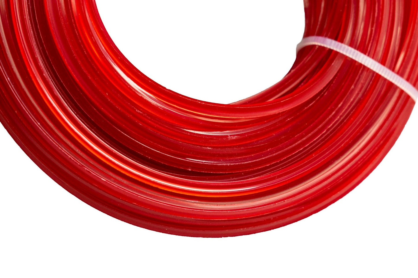Close-up of red strimmer line coil showing 2mm wound strands