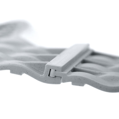 Grey plastic lawn edging clip detail joining two rattan-effect sections