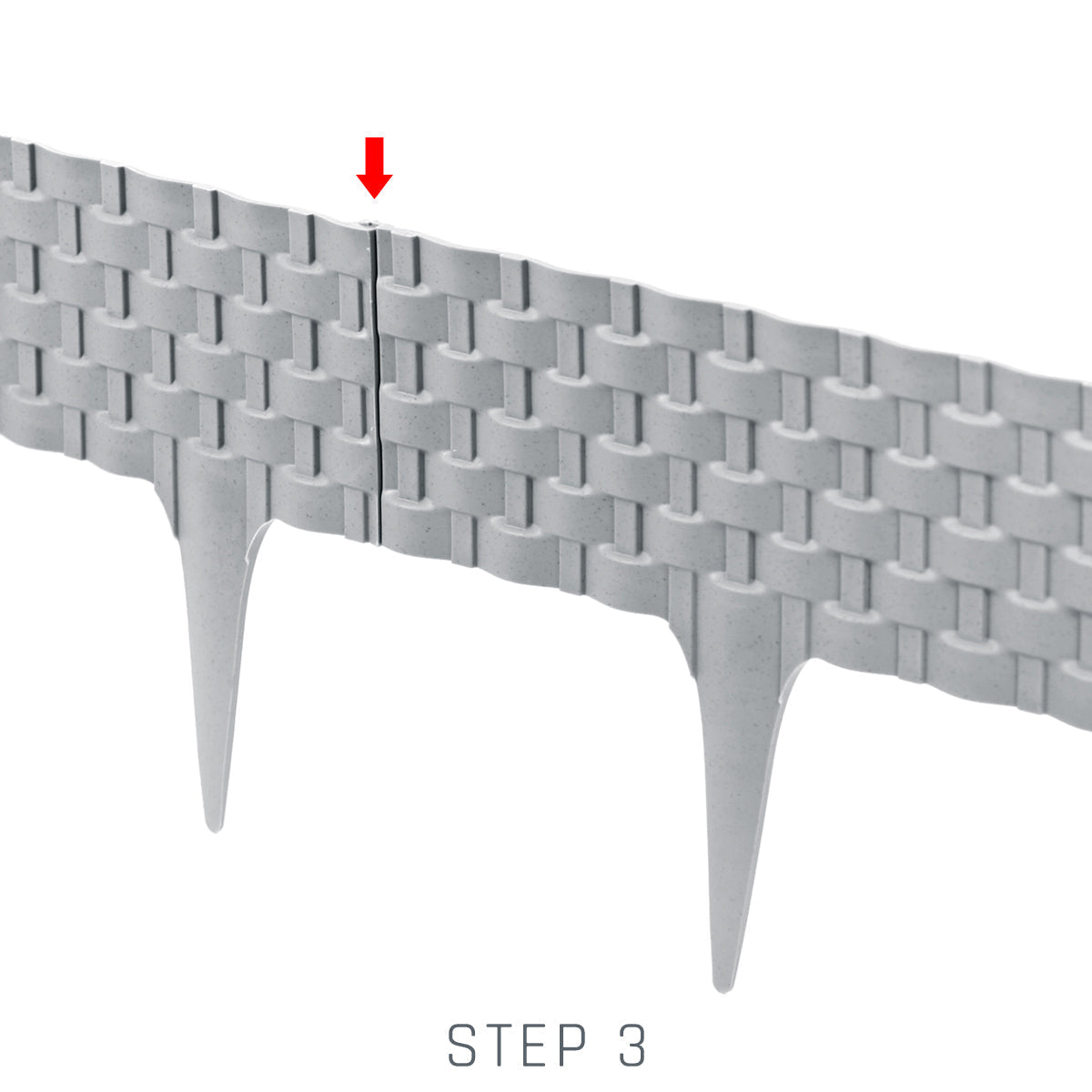 Grey lawn edging step 3 interlock close-up with pointed stakes visible
