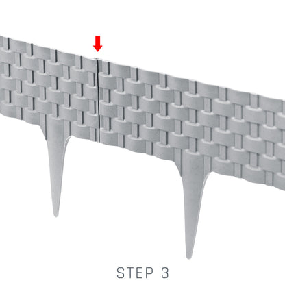 Grey lawn edging step 3 interlock close-up with pointed stakes visible