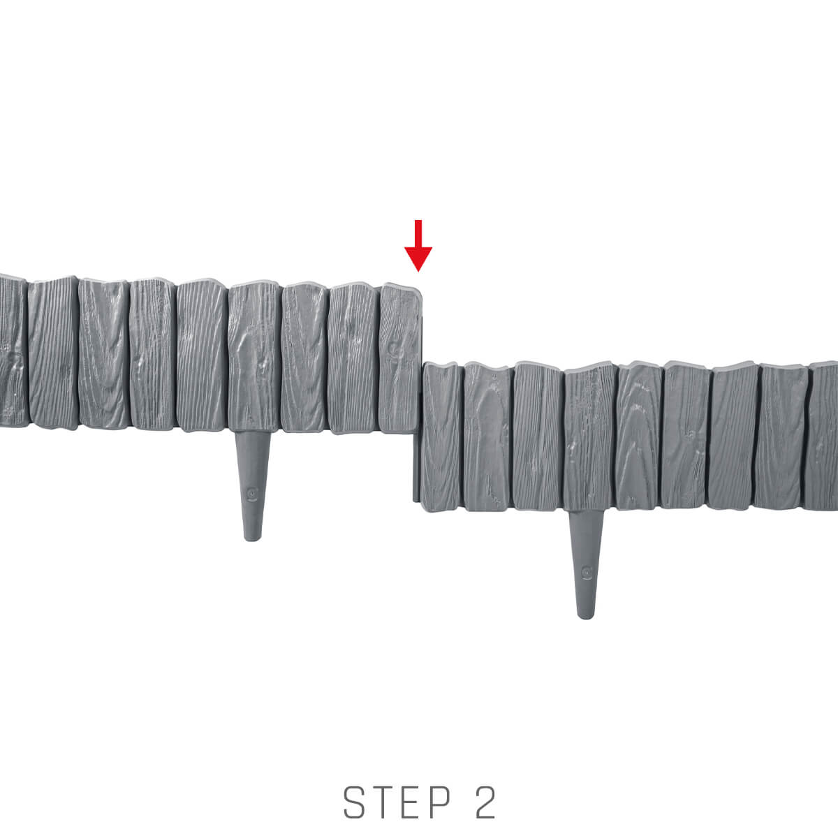Gray plastic lawn edging installation, step 2 showing aligned sections with stakes